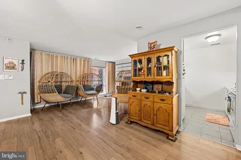 a bedroom with furniture and a wooden floor
