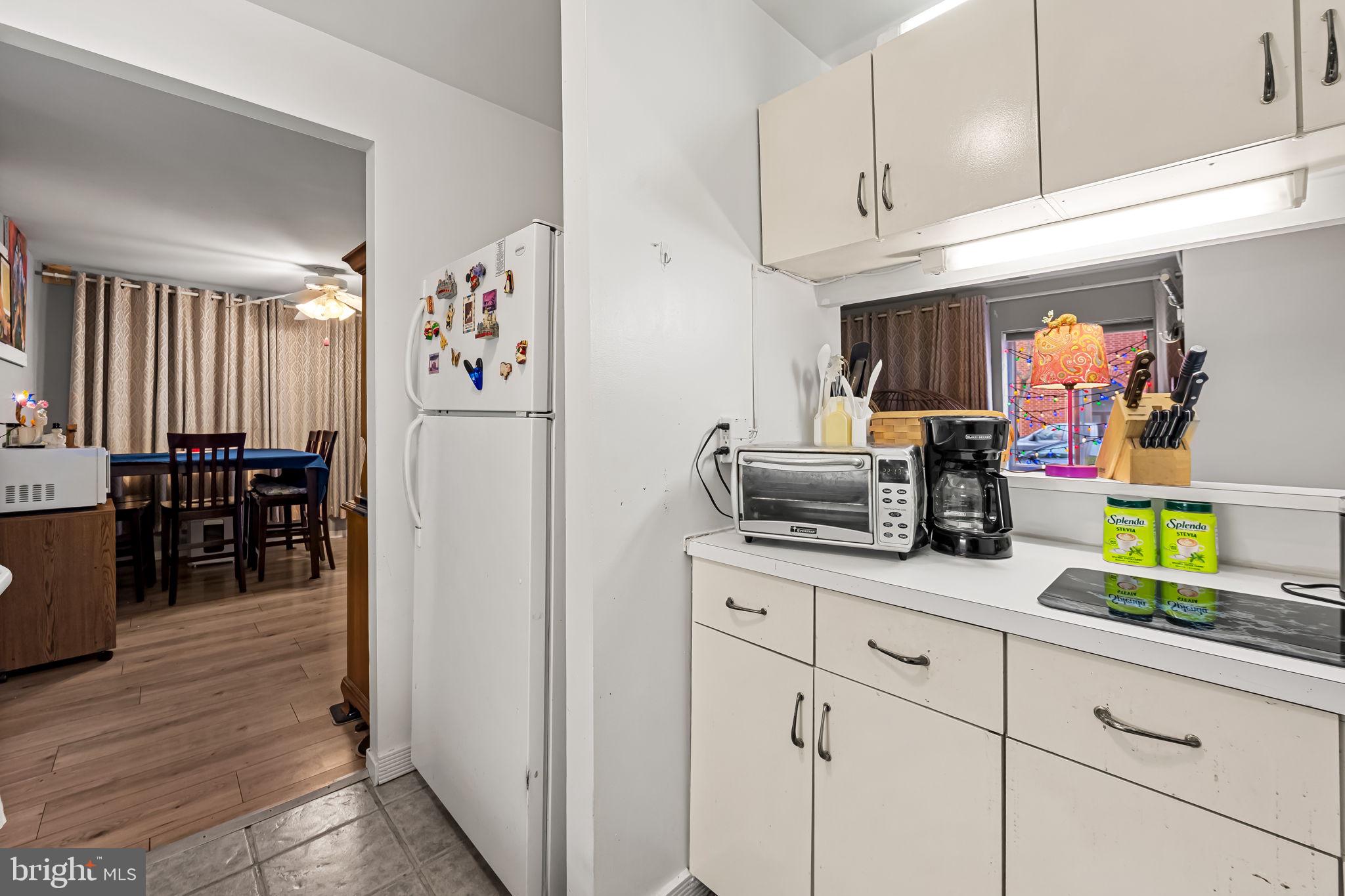 526 South Charles Street, Unit R79 Baltimore, MD 21201 - Photo 10 of 21 a kitchen with cabinets and a refrigerator