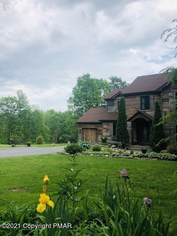 337 Tara Hill Road Bartonsville, PA 18321 - Photo 11 of 37 a backyard of a house with lots of green space and fountain
