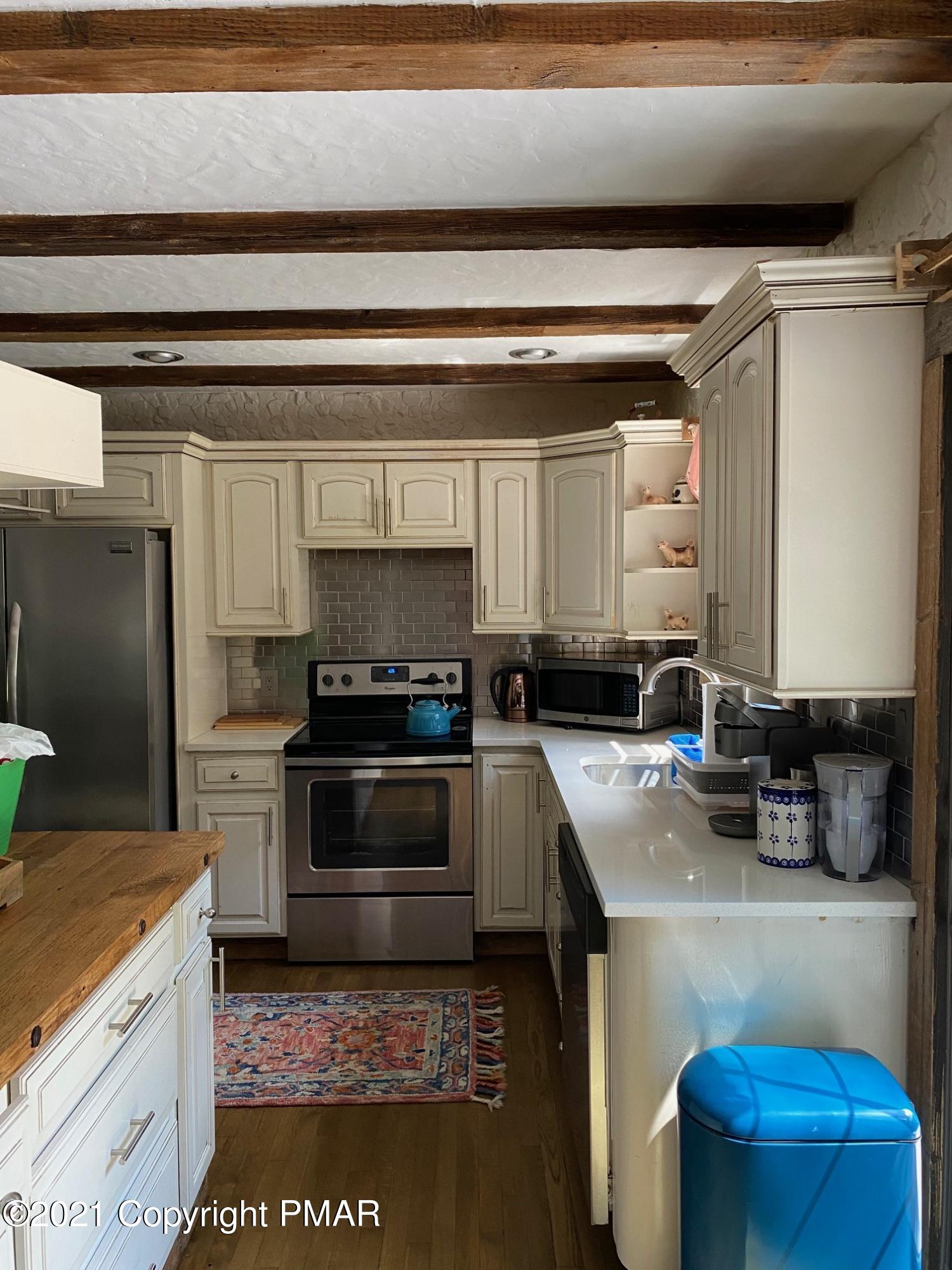 337 Tara Hill Road Bartonsville, PA 18321 - Photo 22 of 37 a kitchen with a sink appliances and cabinets