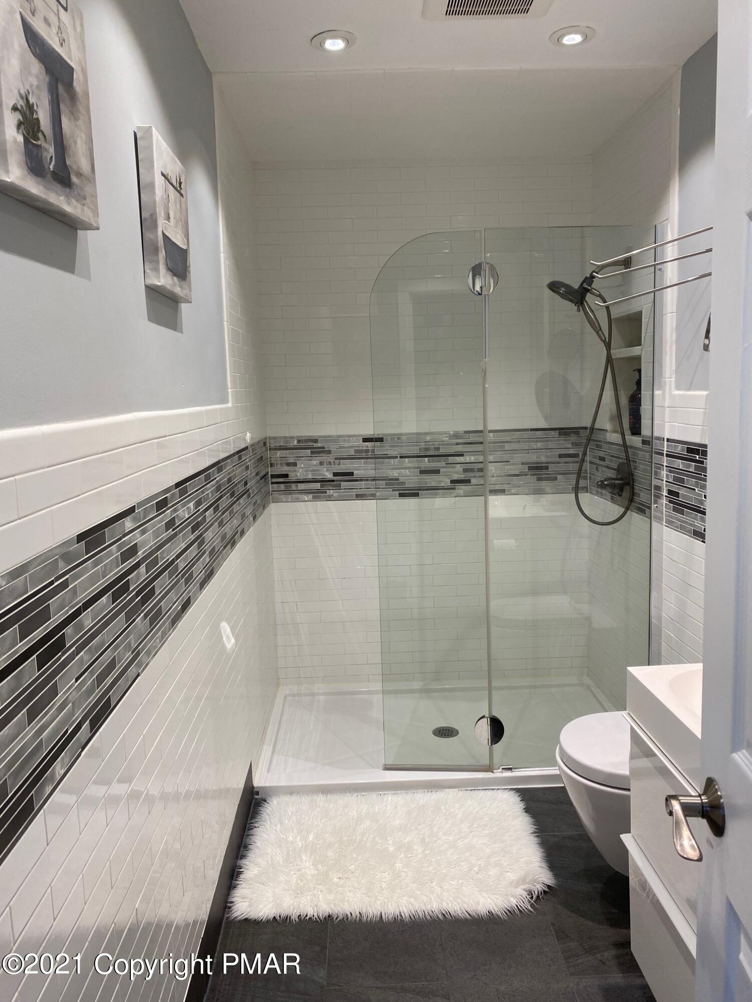 337 Tara Hill Road Bartonsville, PA 18321 - Photo 29 of 37 a bathroom with a granite countertop sink a toilet and shower
