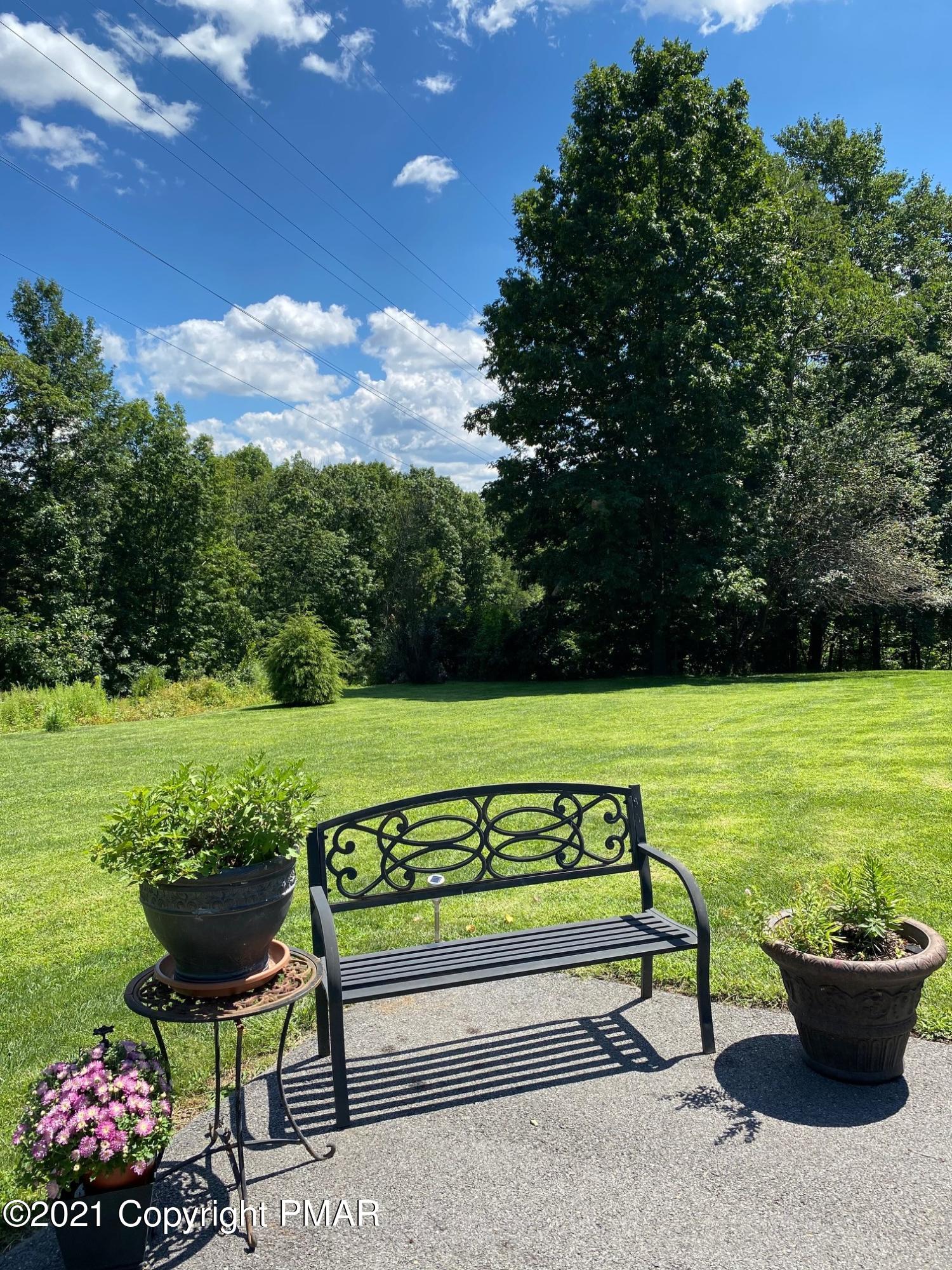 337 Tara Hill Road Bartonsville, PA 18321 - Photo 6 of 37 a view of a bench sitting in the garden
