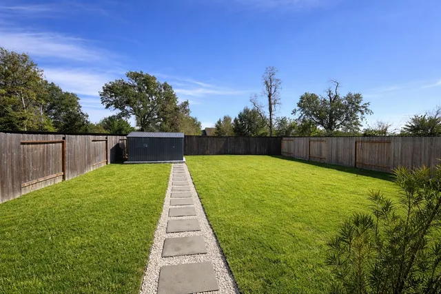 a view of a backyard with green space