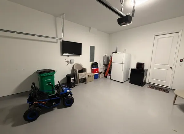 a room with furniture and a flat screen tv