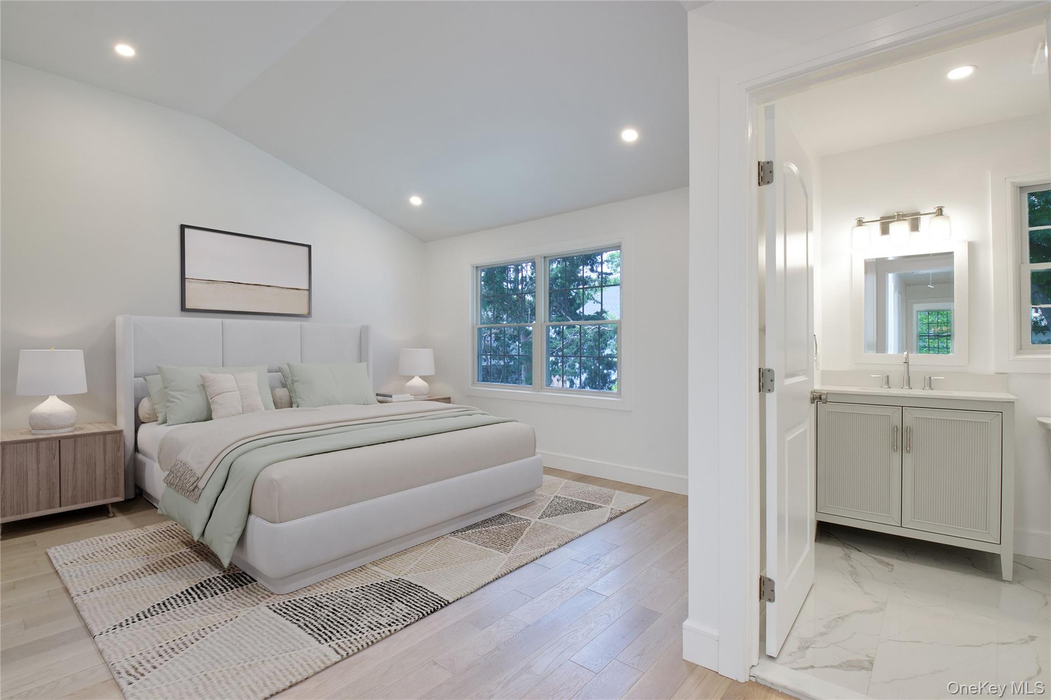 30 Kirkwood Road, Unit B Port Washington, NY 11050 - Photo 16 of 36 a spacious bedroom with a bed and a window