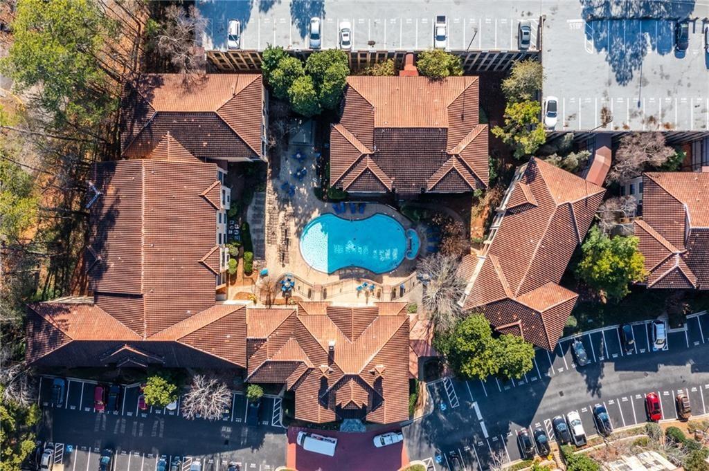 3777 Peachtree Road Northeast, Unit 1212 Atlanta, GA 30319 - Photo 2 of 27 an aerial view of multiple houses with an outdoor space