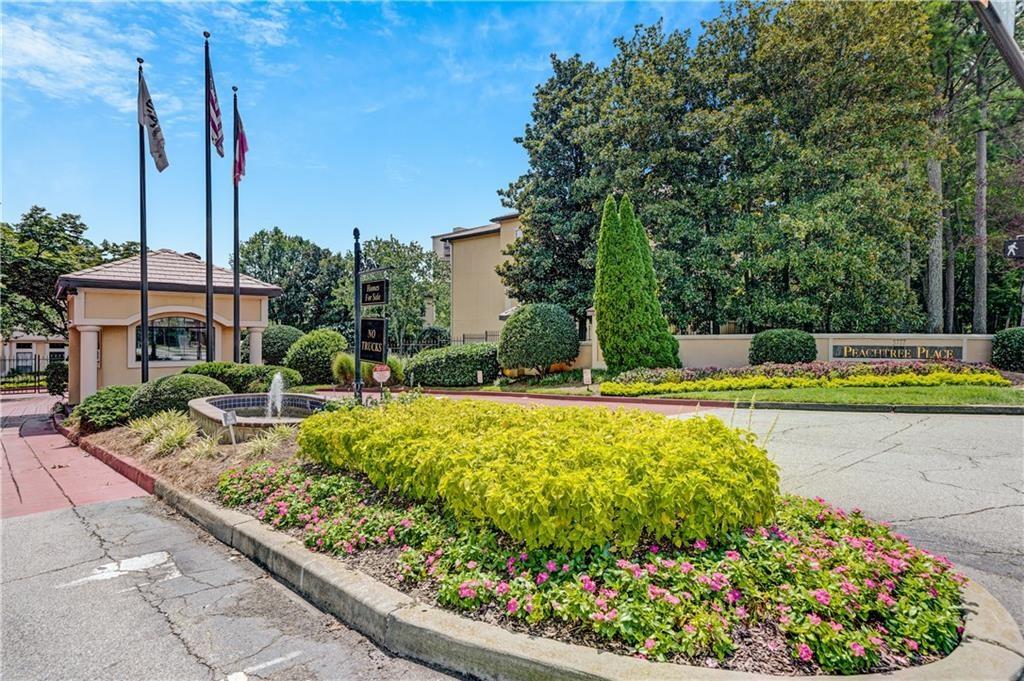 3777 Peachtree Road Northeast, Unit 1212 Atlanta, GA 30319 - Photo 4 of 27 a view of a swimming pool with a yard and potted plants