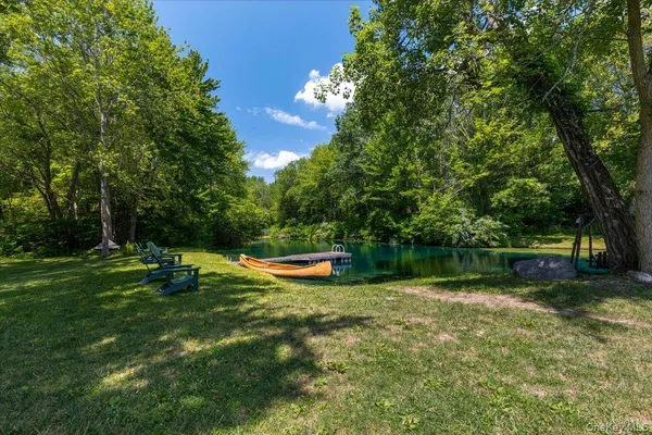 a view of a swimming pool with a yard