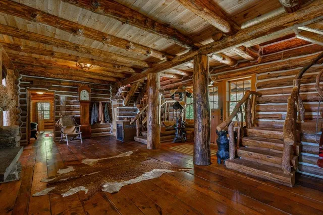 a view of a chairs and table in wooden floor