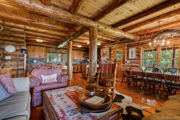 a view of a chairs and table in wooden floor