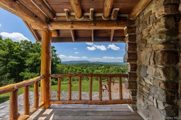 a view of balcony with wooden floor