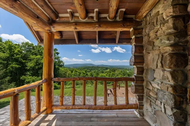 a bedroom with bunk bed and a window