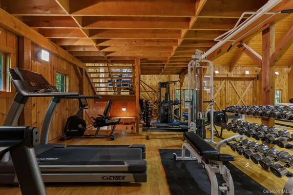 a view of gym with wooden floor