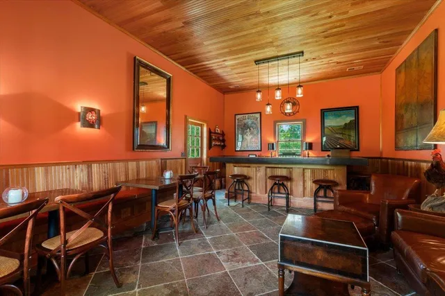a living room with furniture ceiling fan and a rug