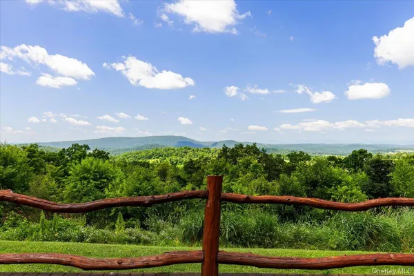 a view of a yard with a street from a window