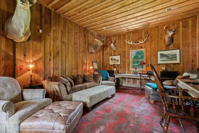 a view of a backyard with a garden and deck