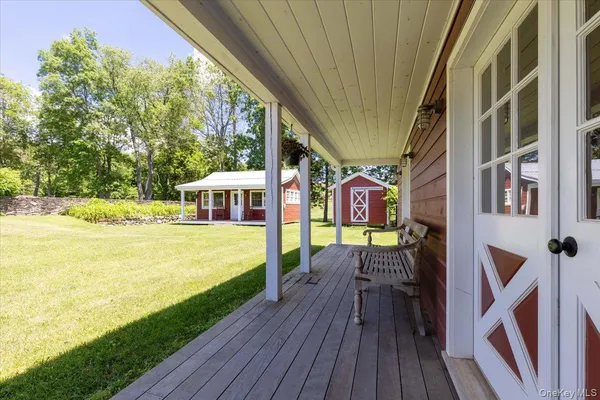 a living room with furniture ceiling fan and a rug