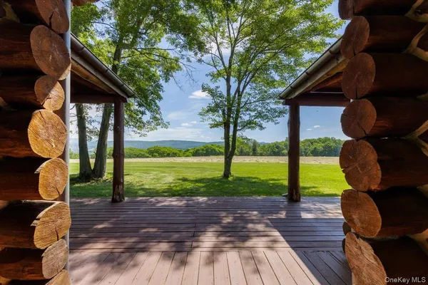 a view of backyard with wooden floor and roof