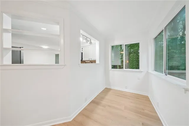 a view of an empty room and window