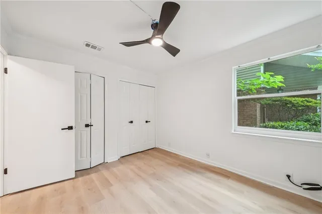 a view of empty room with floor to ceiling window