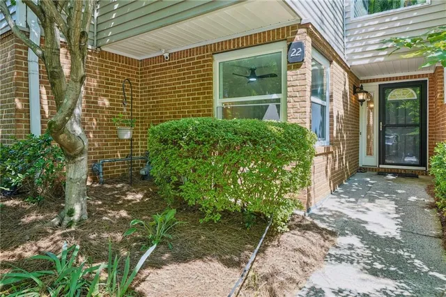 a view of a pathway both side of house