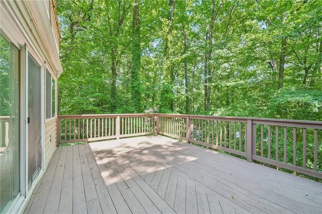a view of balcony with wooden floor