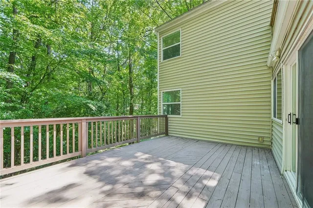 a view of a balcony with wooden floor
