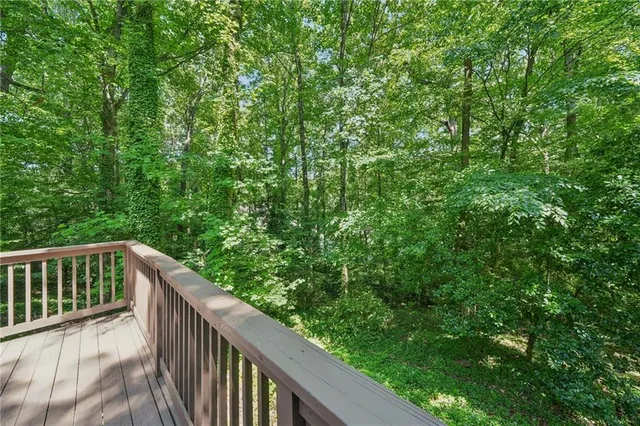 a balcony with wooden fence