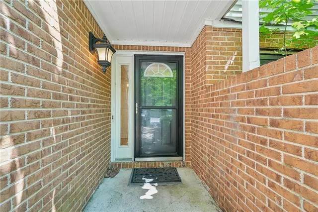 a view of a door and a window