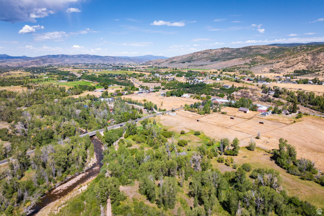 4347 South Bench Creek Road Kamas, UT 84036 - Photo 22 of 30 Expansive rural landscape with a winding river, mature tree coverage, scattered agricultural fields, and distant mountainous terrain