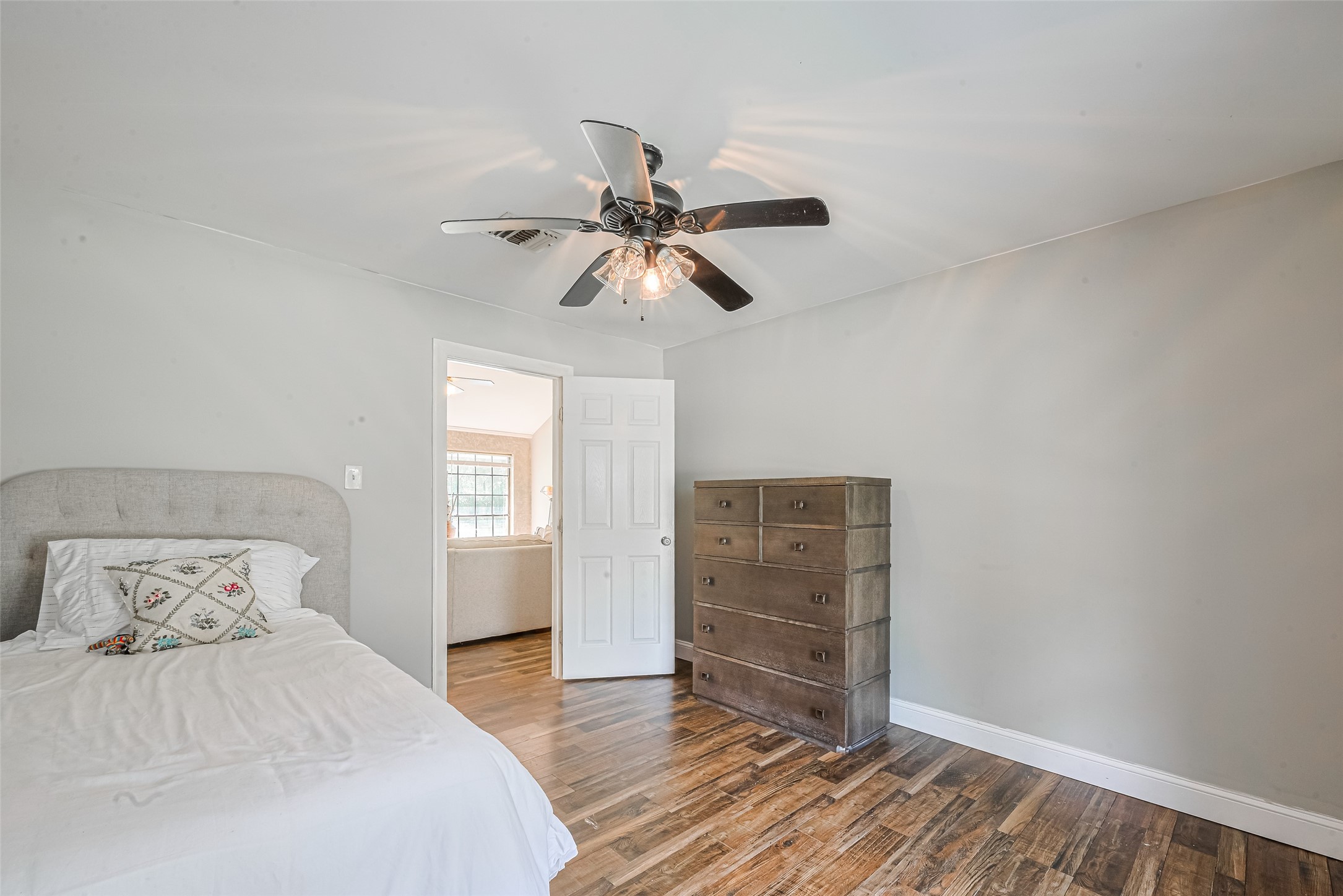 24314 Anderson Street Huffman, TX 77336 - Photo 31 of 48 a bedroom with a bed and a ceiling fan