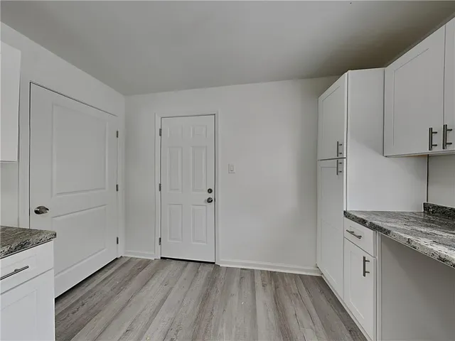 a view of kitchen with wooden floor