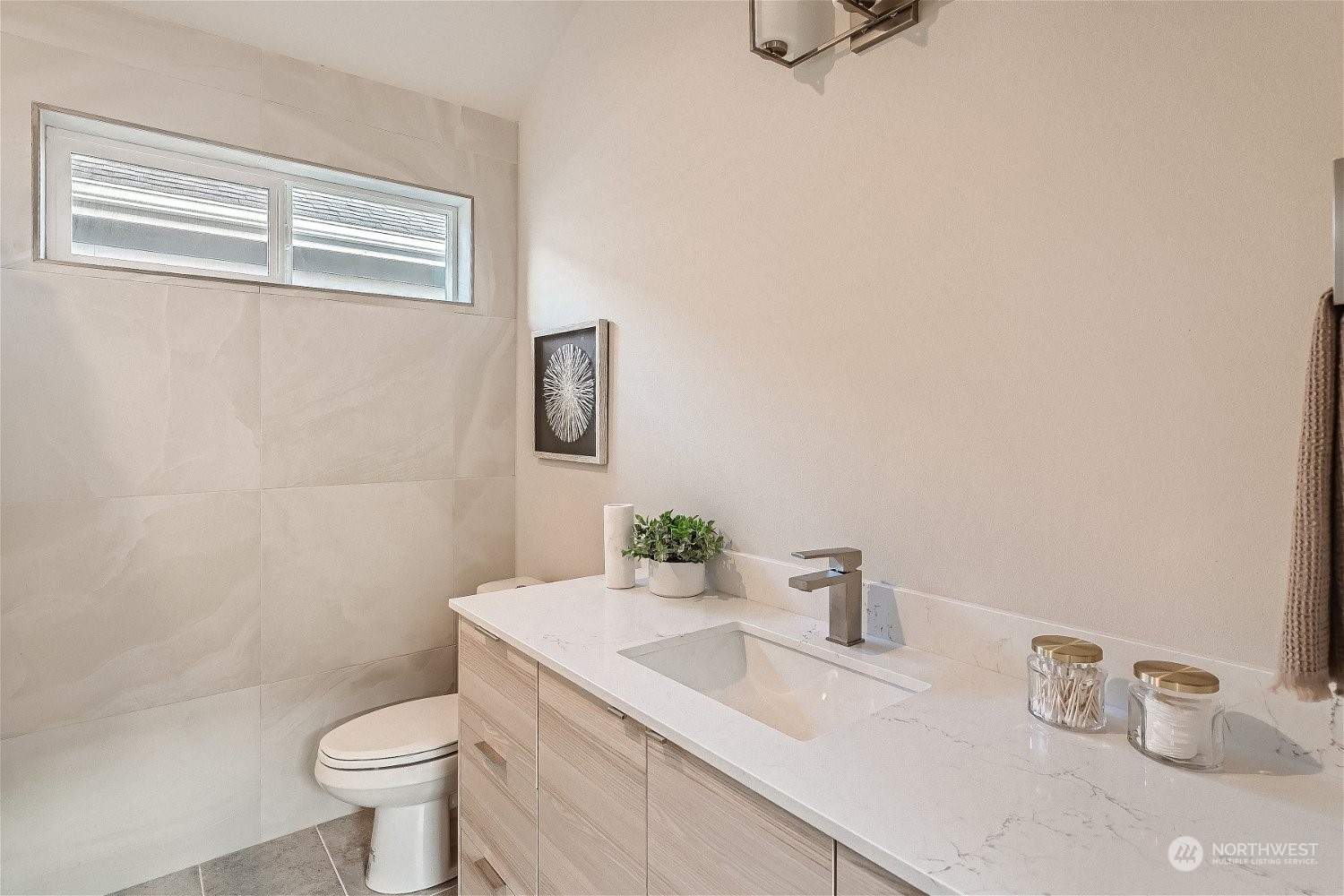 3419 36th Avenue South, Unit A Seattle, WA 98144 - Photo 14 of 23 a bathroom with a sink toilet and a mirror
