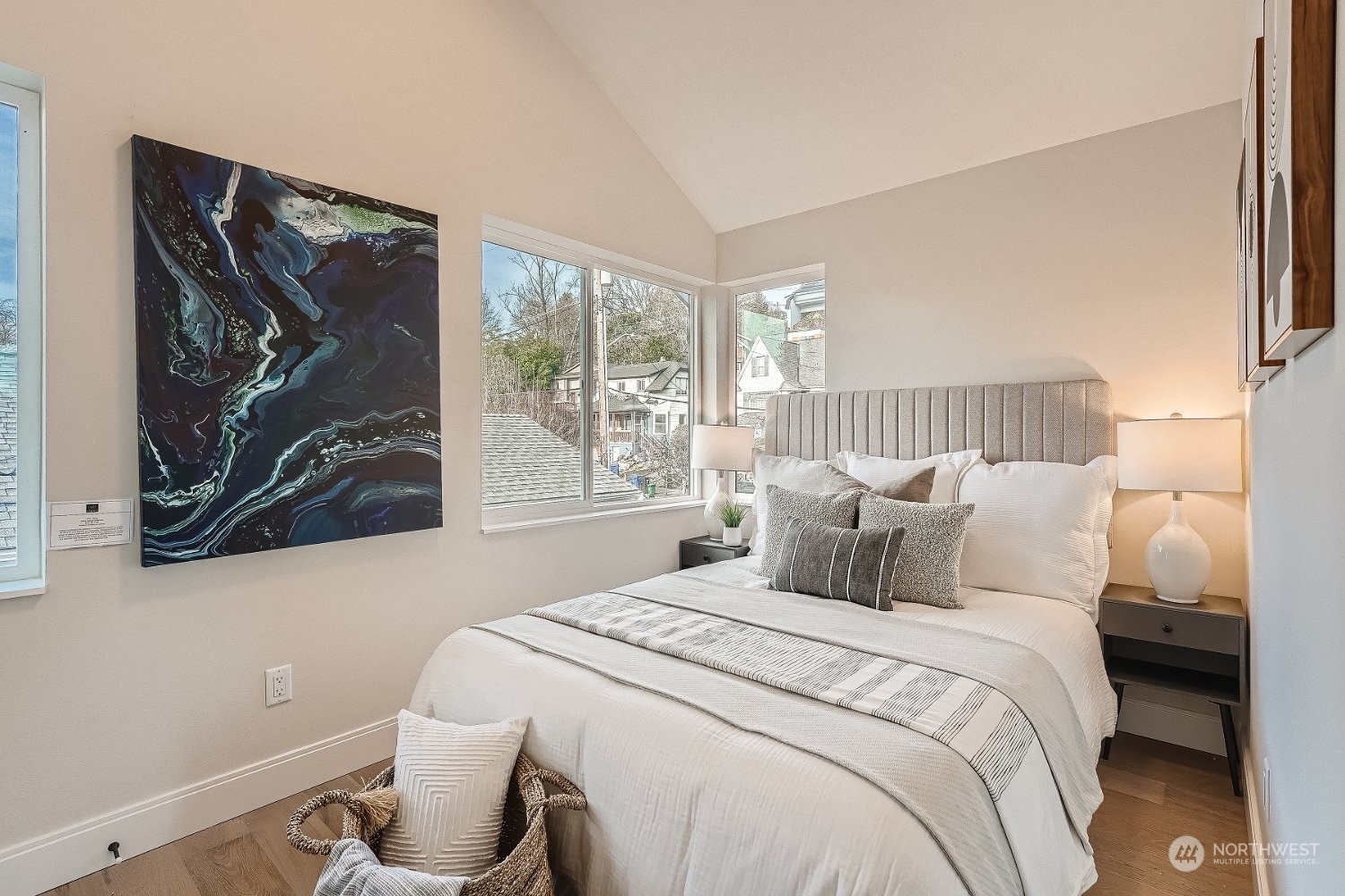 3419 36th Avenue South, Unit A Seattle, WA 98144 - Photo 17 of 23 a bedroom with a bed and a painting on the wall