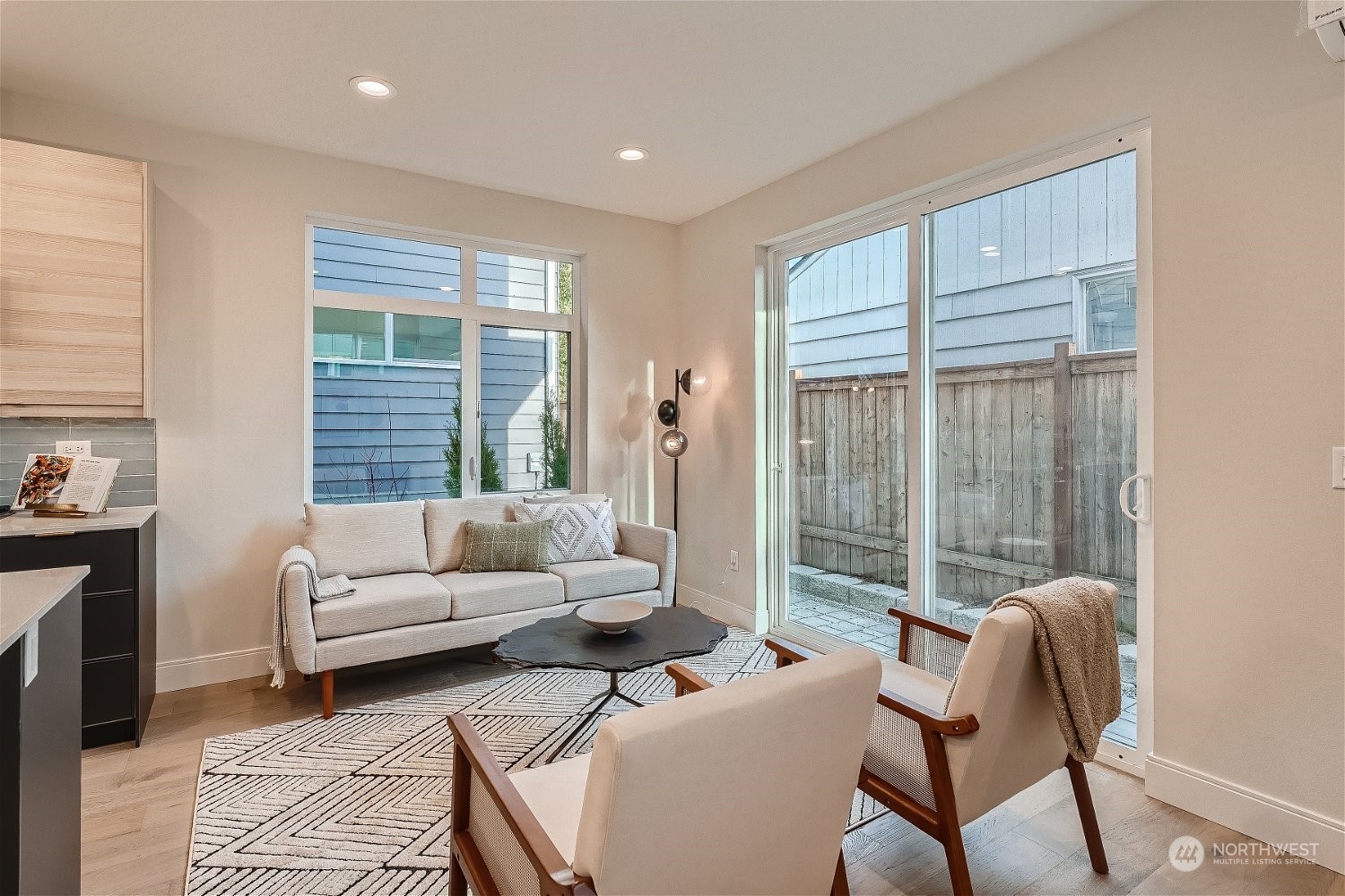 3419 36th Avenue South, Unit A Seattle, WA 98144 - Photo 4 of 23 a living room with furniture and a large window