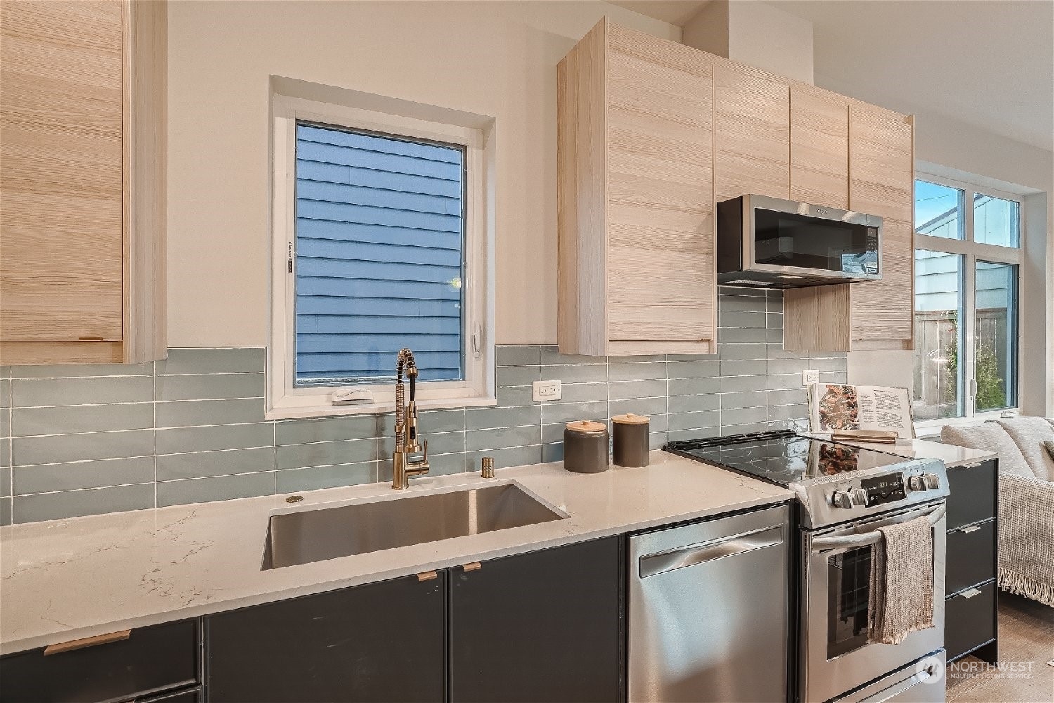 3419 36th Avenue South, Unit A Seattle, WA 98144 - Photo 7 of 23 a kitchen with stainless steel appliances a sink stove and microwave