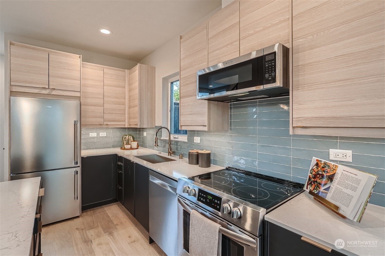 3419 36th Avenue South, Unit A Seattle, WA 98144 - Photo 8 of 23 a kitchen with a sink stove and refrigerator
