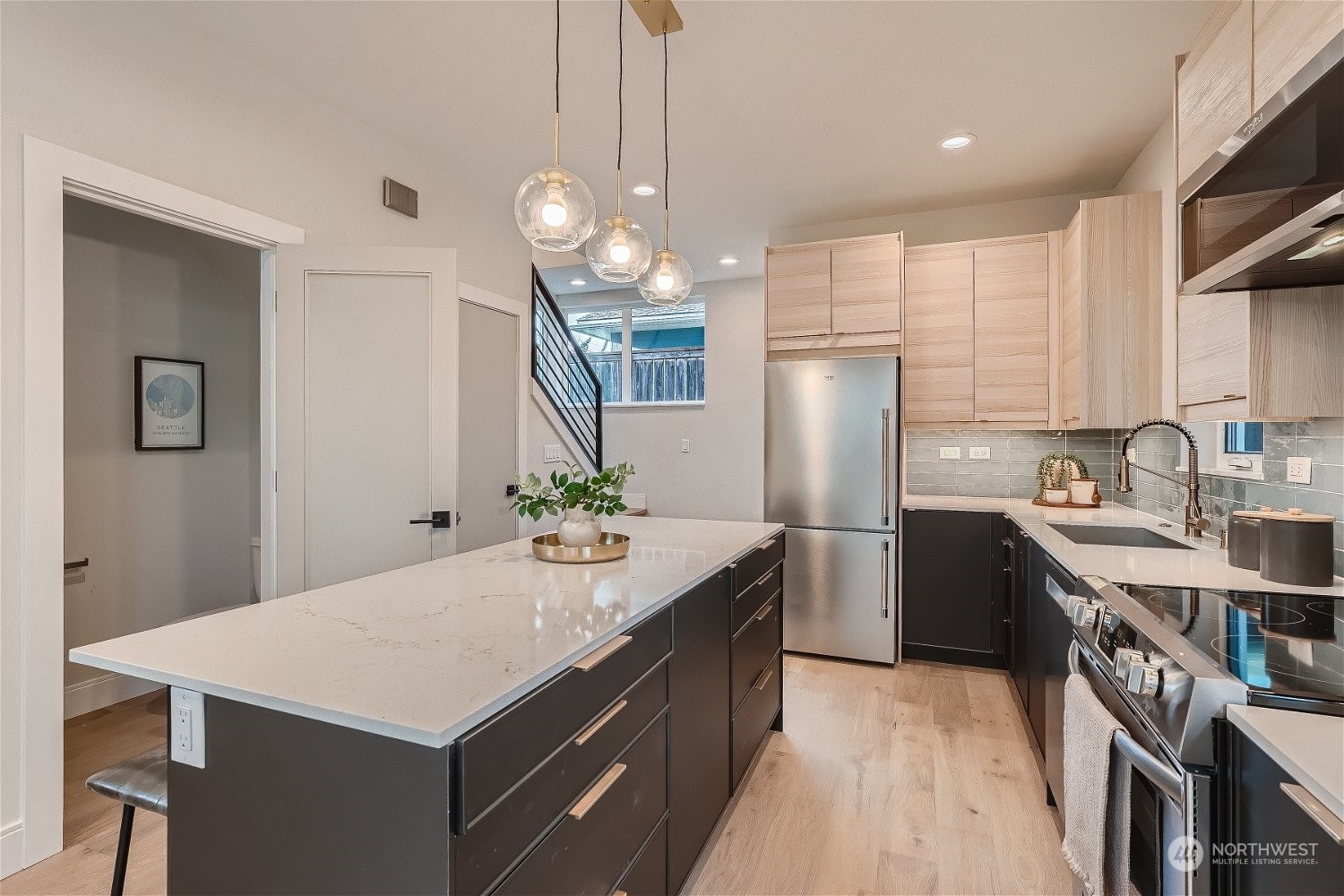 3419 36th Avenue South, Unit A Seattle, WA 98144 - Photo 9 of 23 a kitchen with kitchen island a sink counter space and refrigerator