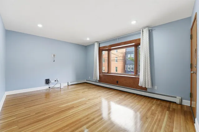 a view of an empty room with a window