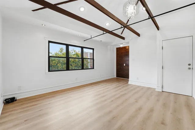 a view of a house with wooden deck