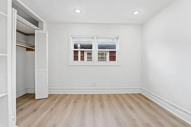 a bathroom with a sink toilet and a mirror