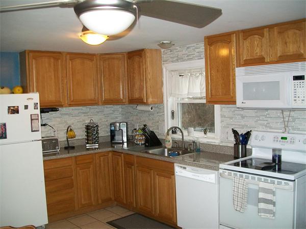 80 Mallowhill Road Springfield, MA 01129 - Photo 23 of 30 a kitchen with stainless steel appliances granite countertop a sink a stove and a refrigerator