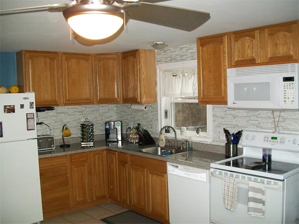 80 Mallowhill Road Springfield, MA 01129 - Photo 4 of 30 a kitchen with sink a refrigerator and cabinets