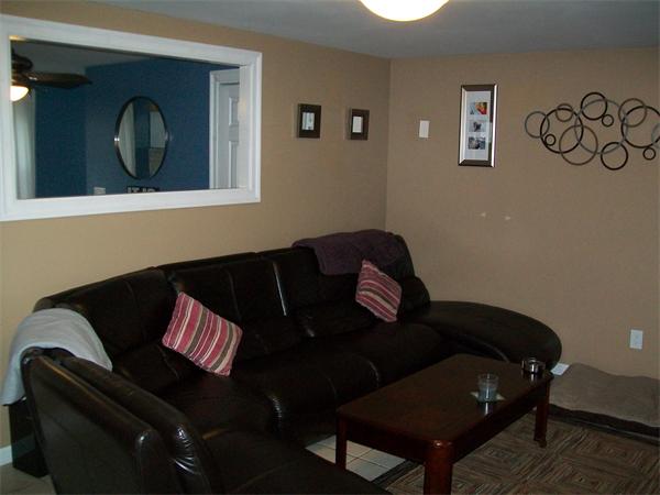 80 Mallowhill Road Springfield, MA 01129 - Photo 8 of 30 a living room with furniture and a painting on the wall