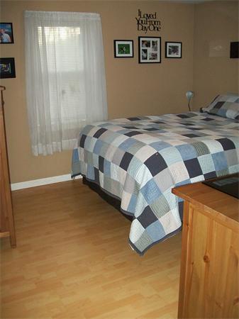 80 Mallowhill Road Springfield, MA 01129 - Photo 9 of 30 a bedroom with a bed and wooden floor