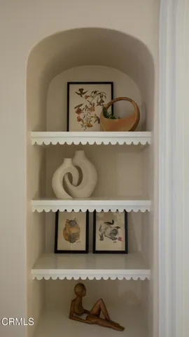 a view of livingroom with furniture and knick knacks on it