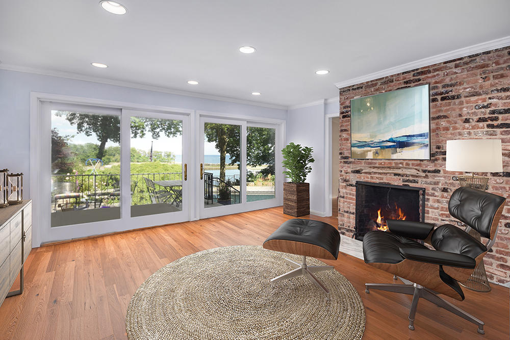 123 Long Neck Point Road Darien, CT 06820 - Photo 11 of 41 a living room with furniture and a fireplace