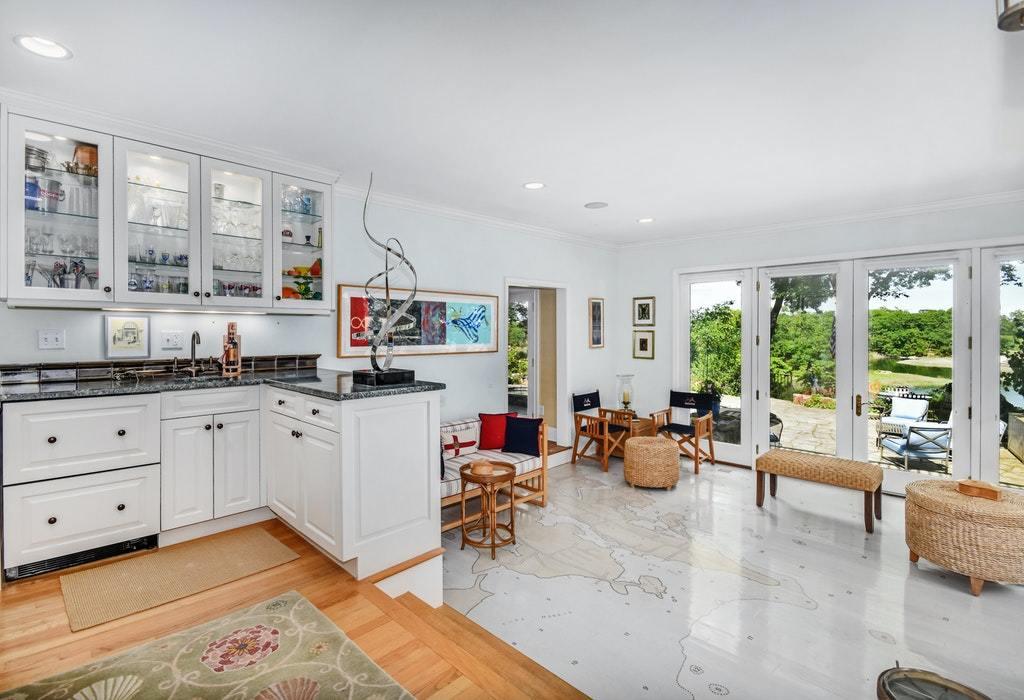 123 Long Neck Point Road Darien, CT 06820 - Photo 15 of 41 a living room with furniture and window