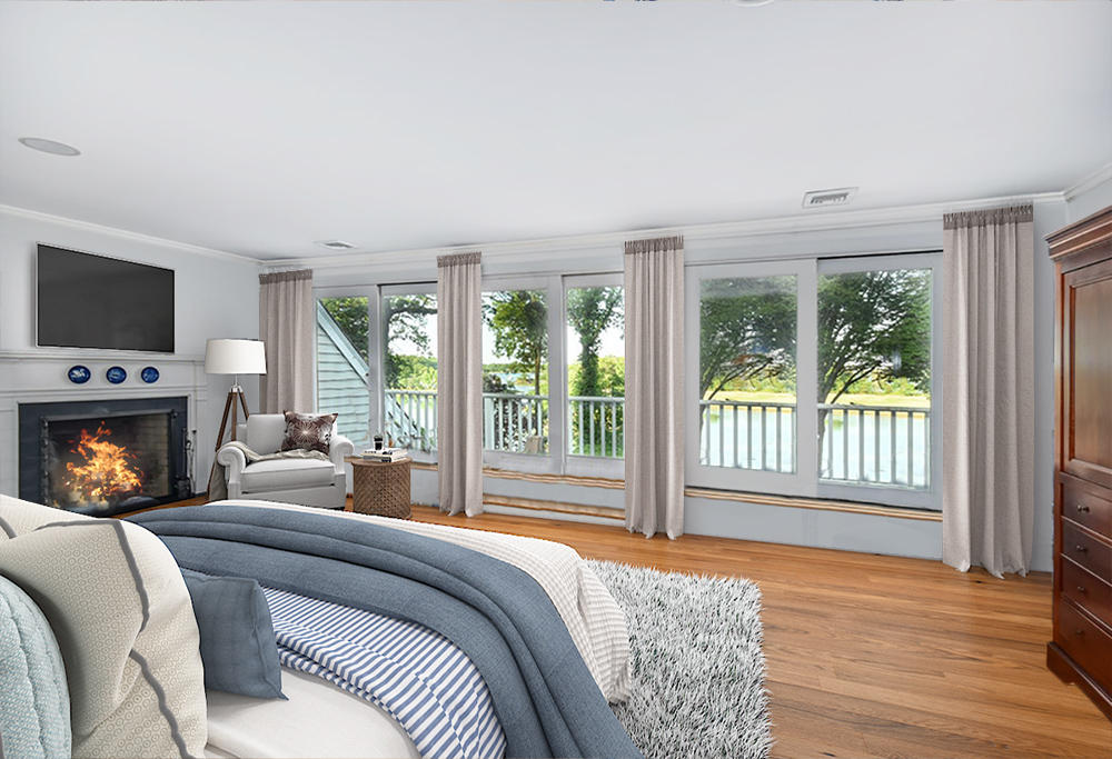 123 Long Neck Point Road Darien, CT 06820 - Photo 19 of 41 a bedroom with a bed and a fireplace