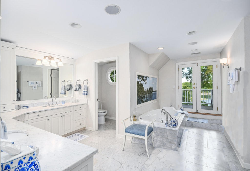 123 Long Neck Point Road Darien, CT 06820 - Photo 21 of 41 a large living room with a large window